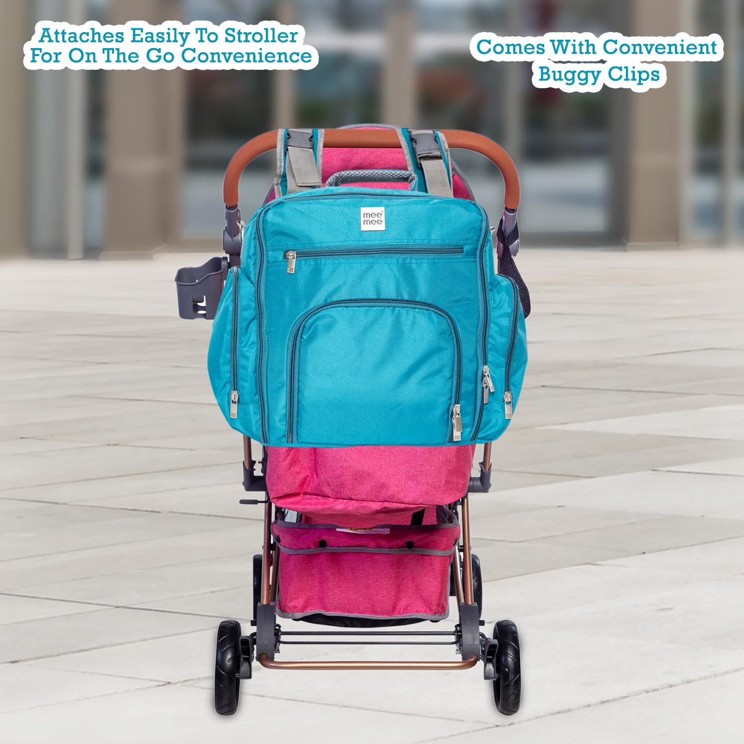 Front view of a blue textured messenger-style diaper bag with various compartments and a Mee Mee brand label. www.usmile.toy